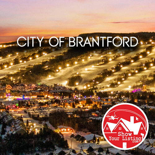 Brantford, Ontario skyline featuring vibrant community growth, real estate photography services, and drone images highlighting residential and industrial developments in a picturesque urban setting.