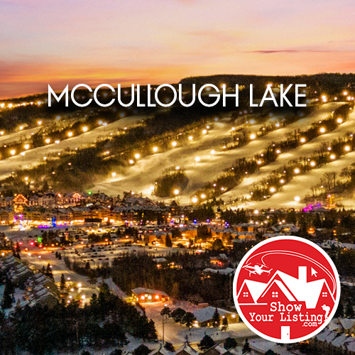 Beautiful aerial view of McCullough Lake in Grey County, showcasing real estate opportunities, fishing, and wildlife, complemented by professional photography and walkthrough video services.