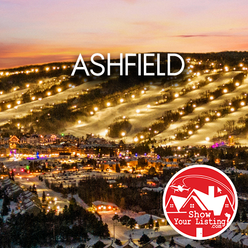 Stunning drone view of Ashfield showcasing picturesque Lake Huron, ideal for real estate photography, family life, and vacationing in a vibrant rural community.